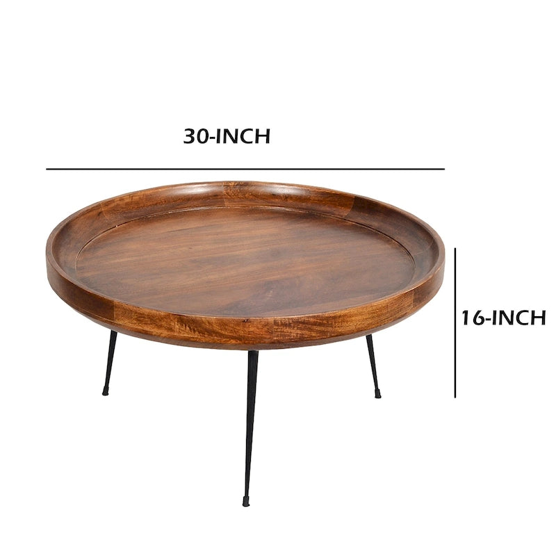 Tavolino da caffè rotondo in legno di mango con gambe metalliche oblique, marrone e nero