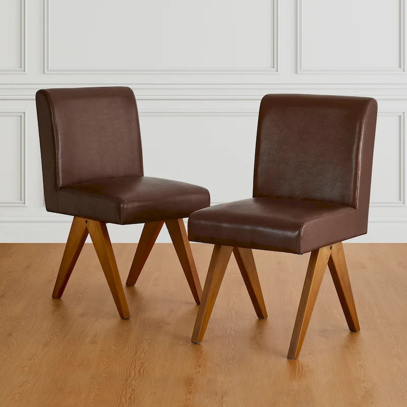Sedie da pranzo imbottite in similpelle con gambe in legno a V